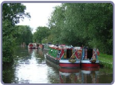Allen boats moored along canal nr Marina